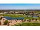 Aerial view showcases the community's golf course, water features, and picturesque landscaping at 3716 E Andre Ave, Gilbert, AZ 85298