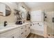 Beautiful bathroom featuring a walk-in shower, soaking tub, dual sinks, and white shaker cabinets at 3716 E Andre Ave, Gilbert, AZ 85298