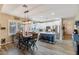 Spacious open-concept kitchen with stainless steel appliances, island seating, and a connected dining area at 3716 E Andre Ave, Gilbert, AZ 85298