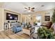 Inviting living room with comfortable seating, a large television, and stylish decor at 3716 E Andre Ave, Gilbert, AZ 85298