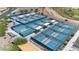 Aerial view of the community's impressive pickleball courts, featuring sun shades and easy access at 3716 E Andre Ave, Gilbert, AZ 85298