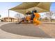 Community playground with slide, swings, and covered seating area offers outdoor fun at 3716 E Andre Ave, Gilbert, AZ 85298