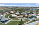 Aerial view of the park's impressive playground with slides, ramps, sun shades, picnic tables, and lush green landscaping at 3716 E Andre Ave, Gilbert, AZ 85298