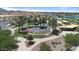 Aerial view of the park's splash pad and playground featuring lush landscaping and surrounding shade trees at 3716 E Andre Ave, Gilbert, AZ 85298