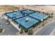 Aerial view of the community's blue tennis and basketball courts featuring sun shades and ample parking at 3716 E Andre Ave, Gilbert, AZ 85298