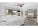 Bright bedroom with mirrored closet doors and views of the patio at 3973 W Hearn Rd, Phoenix, AZ 85053