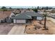 Home exterior with desert landscaping, two-car garage, and a gray roof at 3973 W Hearn Rd, Phoenix, AZ 85053