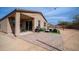 Charming backyard with a covered patio and outdoor seating area at 40433 W Hensley Way, Maricopa, AZ 85138
