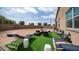 Cozy backyard featuring an outdoor seating area with a grill, ideal for entertaining at 40433 W Hensley Way, Maricopa, AZ 85138
