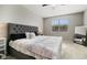 Comfortable bedroom with a plush bed and neutral decor at 40433 W Hensley Way, Maricopa, AZ 85138