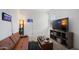 Relaxing bedroom/game room with stylish furnishings and a large television at 40433 W Hensley Way, Maricopa, AZ 85138