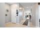 Inviting entryway features tile flooring, neutral walls, and decor at 40433 W Hensley Way, Maricopa, AZ 85138