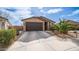 Charming single-Gathering home featuring a well-maintained front yard and attached two-car garage at 40433 W Hensley Way, Maricopa, AZ 85138