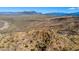 Desert landscape with native vegetation and rocky terrain under a vast blue sky and mountain backdrop at 40445 N 32Nd St, Cave Creek, AZ 85331