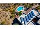 Aerial view of a desert home showing the pool, roof and solar panels on the roof at 40445 N 32Nd St, Cave Creek, AZ 85331