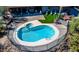 Aerial view of refreshing backyard pool and hot tub with green turf at 40445 N 32Nd St, Cave Creek, AZ 85331