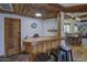 Charming bar area with wood detailing, seating, and rustic accents at 40445 N 32Nd St, Cave Creek, AZ 85331