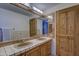 Bathroom featuring a double sink vanity, tile floors and ample lighting at 40445 N 32Nd St, Cave Creek, AZ 85331