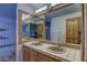 Bathroom with a tile floor, double sinks and a large mirror reflecting the shower at 40445 N 32Nd St, Cave Creek, AZ 85331