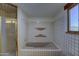 Bathroom with a tile shower, tub and window offering natural light at 40445 N 32Nd St, Cave Creek, AZ 85331