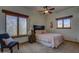 Bright bedroom featuring natural light, a patterned bedspread, and a cozy chair at 40445 N 32Nd St, Cave Creek, AZ 85331