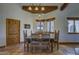 Inviting dining room area featuring a wood table and terracotta tile flooring at 40445 N 32Nd St, Cave Creek, AZ 85331