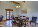 Formal dining room with wooden table, Saltillo tile flooring, and chandelier at 40445 N 32Nd St, Cave Creek, AZ 85331
