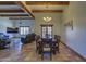 Inviting dining room featuring wood beams, chandelier, and terracotta tile flooring at 40445 N 32Nd St, Cave Creek, AZ 85331