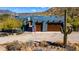 Charming single Gathering home featuring a large garage, solar panels, and desert landscaping at 40445 N 32Nd St, Cave Creek, AZ 85331