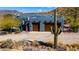 Charming single Gathering home featuring a large garage, solar panels, and desert landscaping at 40445 N 32Nd St, Cave Creek, AZ 85331