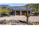 Aerial view of southwest home with two-car garage, desert landscaping, and mountain backdrop at 40445 N 32Nd St, Cave Creek, AZ 85331