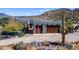 Exterior elevation featuring a two-car garage, desert landscaping and an American flag at 40445 N 32Nd St, Cave Creek, AZ 85331