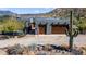 Exterior elevation featuring a two-car garage, beautiful landscaping, and solar panels at 40445 N 32Nd St, Cave Creek, AZ 85331