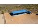 Aerial view of horse property with arena, shelter, and vehicles in a natural desert setting at 40445 N 32Nd St, Cave Creek, AZ 85331