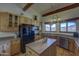 Charming kitchen with wood cabinetry, island, and views of the surrounding landscape at 40445 N 32Nd St, Cave Creek, AZ 85331