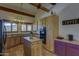 Charming kitchen featuring wood cabinetry, center island, and contrasting countertops at 40445 N 32Nd St, Cave Creek, AZ 85331