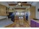 Spacious kitchen featuring a central island, wood beams, and stainless steel appliances at 40445 N 32Nd St, Cave Creek, AZ 85331