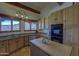 Traditional kitchen featuring wood cabinets, an island, and a view of the scenic landscape at 40445 N 32Nd St, Cave Creek, AZ 85331