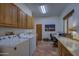 Functional laundry room and office with ample storage and natural light at 40445 N 32Nd St, Cave Creek, AZ 85331