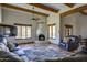 Cozy living room with fireplace, beamed ceilings, and Saltillo tile flooring at 40445 N 32Nd St, Cave Creek, AZ 85331