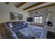 Open living room with vaulted ceilings, a cozy fireplace, and beautiful desert views at 40445 N 32Nd St, Cave Creek, AZ 85331