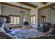 Spacious living room featuring exposed wood beams and a traditional fireplace at 40445 N 32Nd St, Cave Creek, AZ 85331