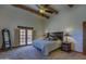 Stylish main bedroom with beamed ceilings, a king bed, and outdoor access at 40445 N 32Nd St, Cave Creek, AZ 85331