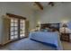 Bright main bedroom with a king bed, beamed ceilings and outdoor views at 40445 N 32Nd St, Cave Creek, AZ 85331