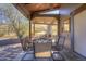 Covered outdoor patio with an elegant dining set and built-in fireplace offering scenic views at 40445 N 32Nd St, Cave Creek, AZ 85331