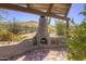 Outdoor brick oven and entertaining space with pergola offering views of the desert landscape at 40445 N 32Nd St, Cave Creek, AZ 85331