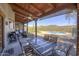 Covered patio features outdoor dining and mountain views at 40445 N 32Nd St, Cave Creek, AZ 85331