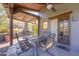 Covered patio features an outdoor dining area with a fireplace at 40445 N 32Nd St, Cave Creek, AZ 85331