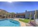 Beautiful pool and spa with desert landscaping, set against the backdrop of serene mountain views at 40445 N 32Nd St, Cave Creek, AZ 85331