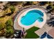 An aerial view of the backyard pool and patio, with lush plants at 40445 N 32Nd St, Cave Creek, AZ 85331